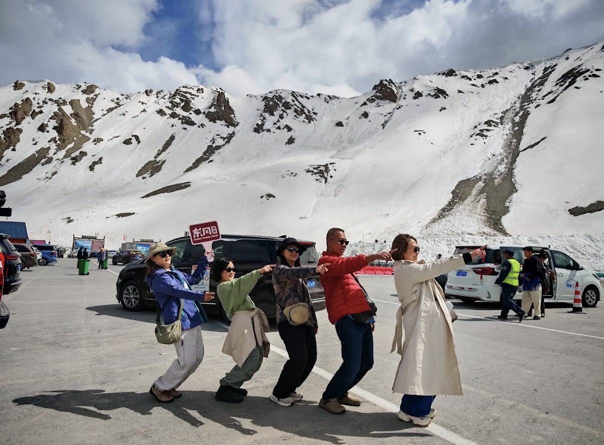 Our group taking a break among the snowy peaks of the Duku Highway